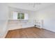 Bedroom with hardwood floors, shelving and bright window at 122 Spreading Oak Ct, Sanford, FL 32773