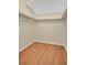 Walk-in closet featuring wood-look flooring and shelving at 122 Spreading Oak Ct, Sanford, FL 32773