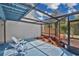 Screened patio with a seating area at 122 Spreading Oak Ct, Sanford, FL 32773