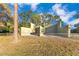 Community recreation area featuring a fenced in structure on a grassy field under a sunny blue sky at 122 Spreading Oak Ct, Sanford, FL 32773