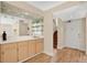 Stylish wet bar adjacent to the entrance and staircase, featuring bright white countertops at 122 Spreading Oak Ct, Sanford, FL 32773