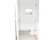 Bathroom featuring white marble tiled walls surrounding a tub and a modern sink with wood-look flooring at 1350 Martin Luther King Jr Blvd, Bartow, FL 33830