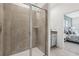 Sleek bathroom with a glass-enclosed shower and a gray vanity at 1355 Wood Line Loop, Deland, FL 32720