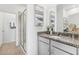 Modern bathroom featuring a gray granite countertop and a glass-enclosed shower at 1355 Wood Line Loop, Deland, FL 32720