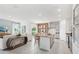 Bright, open living space with a modern kitchen, dining area, and comfortable seating at 1355 Wood Line Loop, Deland, FL 32720