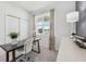 Bright office space with a large window, neutral decor, and ample natural light at 1355 Wood Line Loop, Deland, FL 32720