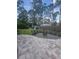 Beautiful backyard featuring a stone patio, fire pit with chairs, playground, and privacy fence at 14641 Henson Rd, Orlando, FL 32832