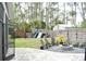 Large backyard features a fire pit, play set, and lush lawn at 14641 Henson Rd, Orlando, FL 32832