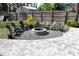 Backyard featuring a paver patio and firepit surrounded by chairs, perfect for outdoor gatherings and relaxation at 14641 Henson Rd, Orlando, FL 32832