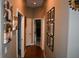 Hallway featuring wood floors, fresh paint, and Gathering photos at 14641 Henson Rd, Orlando, FL 32832