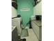 Efficient laundry room with a washer, dryer, cabinets, countertop, and storage space at 14641 Henson Rd, Orlando, FL 32832