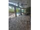 Covered patio with ceiling fans, dining table, and chairs overlooking the pool, perfect for outdoor entertaining at 14641 Henson Rd, Orlando, FL 32832