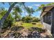 Spacious backyard featuring a circular fire pit and perimeter plants providing privacy at 1510 Chatsworth Ave, Deltona, FL 32738