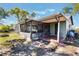 Exterior view of a screened in lanai with concrete flooring, patio, and spacious backyard at 1510 Chatsworth Ave, Deltona, FL 32738