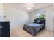 Simple bedroom with tile floor and a window with a view of palm trees outside at 1510 Chatsworth Ave, Deltona, FL 32738