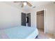 This bedroom features neutral walls, updated ceiling fan, and a walk-in closet at 1510 Chatsworth Ave, Deltona, FL 32738