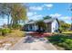 Charming single-story home featuring a well-manicured lawn and beautiful landscaping at 1510 Chatsworth Ave, Deltona, FL 32738