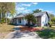 Charming single-story home featuring a well-manicured lawn and beautiful landscaping at 1510 Chatsworth Ave, Deltona, FL 32738