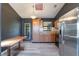 Kitchen with stainless steel appliances, wood cabinets, modern flooring and skylight at 1510 Chatsworth Ave, Deltona, FL 32738