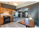 Bright kitchen with stainless steel appliances, wood cabinets and a view of the living area at 1510 Chatsworth Ave, Deltona, FL 32738