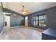 View of the living room featuring wood floors, gray walls, and an open floor plan at 1510 Chatsworth Ave, Deltona, FL 32738