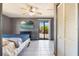 Main bedroom with ceiling fan, dresser, and sliding glass doors to the backyard at 1510 Chatsworth Ave, Deltona, FL 32738