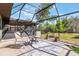 Inviting screened patio with ample seating, ideal for outdoor entertaining and relaxing at 1510 Chatsworth Ave, Deltona, FL 32738