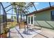 Cozy screened patio with outdoor furniture, perfect for enjoying the backyard view at 1510 Chatsworth Ave, Deltona, FL 32738