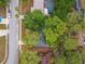 Aerial view of a home and the surrounding neighborhood with mature landscaping at 1514 Pelican St, Longwood, FL 32750