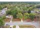 Aerial view of a home with mature trees in a quiet neighborhood at 1514 Pelican St, Longwood, FL 32750
