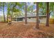 Spacious backyard featuring a screened-in porch and mature trees, creating a relaxing outdoor space at 1514 Pelican St, Longwood, FL 32750