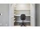 Office nook inside of a closet with built-in desk and shelving at 1514 Pelican St, Longwood, FL 32750