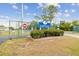 Entrance to Candyland Sports Complex featuring a welcoming sign, landscaping, and secure gate at 1514 Pelican St, Longwood, FL 32750