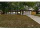 Inviting single-story home featuring a well-lit facade, and a two-car garage at 1514 Pelican St, Longwood, FL 32750