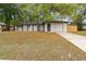 Charming single-story home with well-manicured lawn, inviting curb appeal at 1514 Pelican St, Longwood, FL 32750