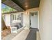 Inviting front porch with a swing and a decorative front door, creating a welcoming entrance at 1514 Pelican St, Longwood, FL 32750