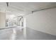 Spacious garage with a pristine epoxy floor, convenient access to the interior, and ample room for storage at 1514 Pelican St, Longwood, FL 32750