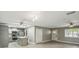 Open floor plan kitchen with island, light-colored cabinets and stainless steel appliances at 1514 Pelican St, Longwood, FL 32750