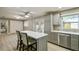 Spacious kitchen with an island, stainless steel appliances, and plenty of natural light at 1514 Pelican St, Longwood, FL 32750