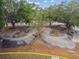 Scenic pump track with smooth, winding asphalt paths amidst lush greenery, perfect for biking and skating enthusiasts at 1514 Pelican St, Longwood, FL 32750