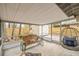 Inviting screened porch with cozy seating and views of the backyard, perfect for relaxing and enjoying the outdoors at 1514 Pelican St, Longwood, FL 32750