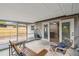 Relaxing screened porch with stylish hanging chair, seating, and seamless transition to the interior at 1514 Pelican St, Longwood, FL 32750