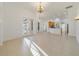 Bright and open living room with tile floors, arched doorways, and French doors leading to the outside at 1521 Gants Cir, Kissimmee, FL 34744