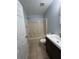 Bathroom featuring a tub-shower combo and a single sink vanity at 15279 Sugargrove Way, Orlando, FL 32828