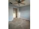 This bedroom includes carpet, a ceiling fan, and closet space at 15279 Sugargrove Way, Orlando, FL 32828