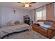 Bedroom features a comfortable couch and a large bed at 15279 Sugargrove Way, Orlando, FL 32828