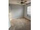 Cozy bedroom with a ceiling fan, carpet flooring, and a window at 15279 Sugargrove Way, Orlando, FL 32828