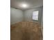 Simple bedroom with window with blinds and neutral carpet at 15279 Sugargrove Way, Orlando, FL 32828