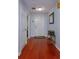 Entryway with hardwood floors, front door, and neutral walls leading into the home at 15279 Sugargrove Way, Orlando, FL 32828