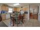 Cozy kitchen with stainless steel appliances, light wood cabinetry, and breakfast nook at 15279 Sugargrove Way, Orlando, FL 32828